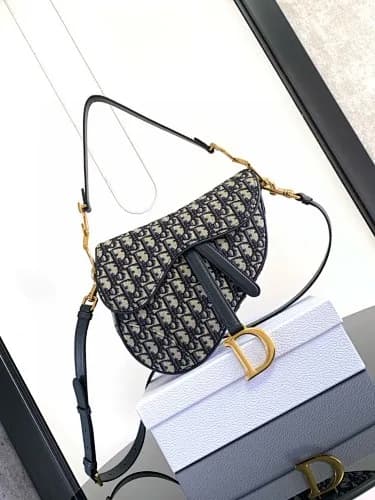 Dior (modelo Dior Saddle Bag em tela Oblique Jacquard azul/cinzento)
