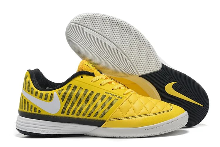 Nike Lunar Gato II (em tom amarelo, preto e branco com sola branca).
